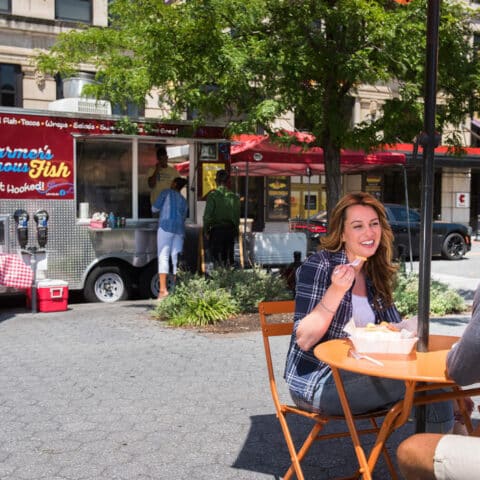 couple eating at food truck near apartments in wilmington de